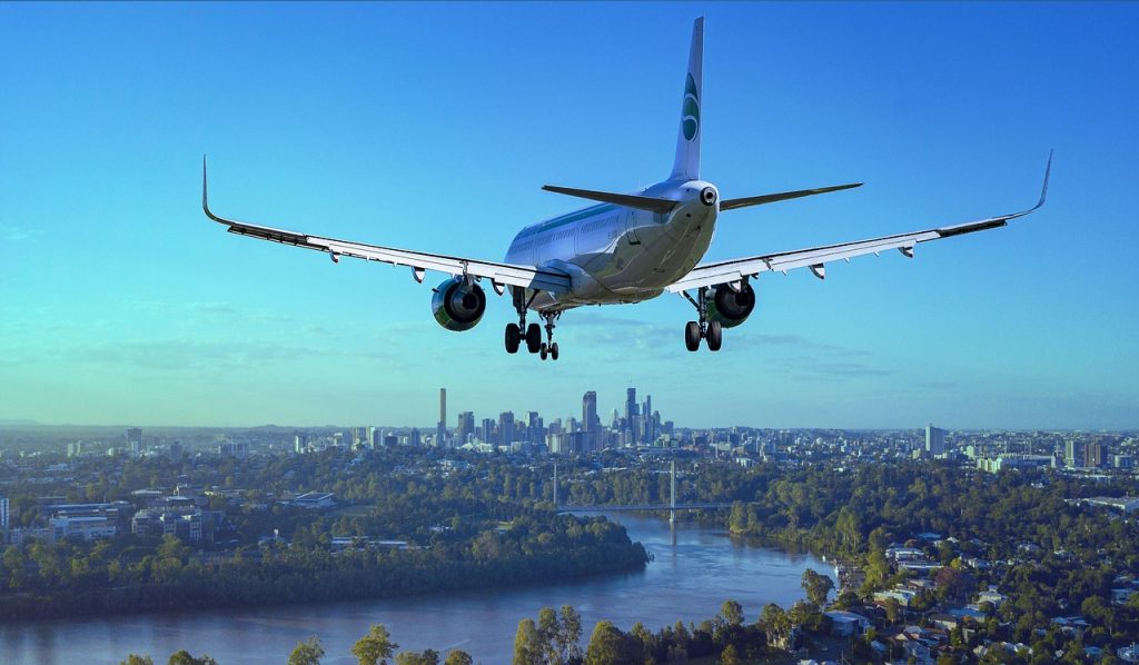 airplane, flight, city, landing, nature, river, boeing, aircraft, plane, travel, flying, sky, passenger aircraft, airliner, aviation, arrival, transport, skyscrapers, urban