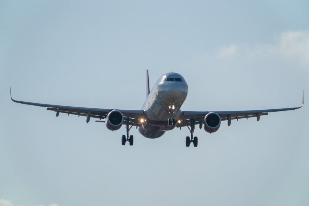 A commercial airplane approaches for landing at Manises Airport in Valencia, Spain.
